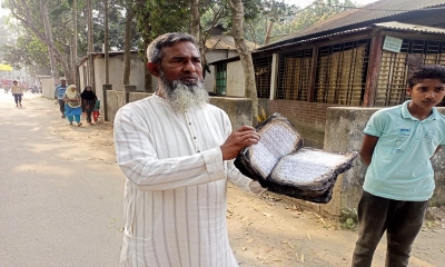 বাড়ি পুড়ে ছাই হলেও অক্ষত কোরআন